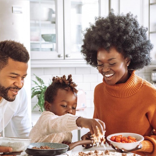 a family cooking together